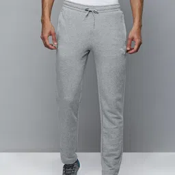 Puma Men Solid Slim Fit Zippered Knitted Mid-Rise Track Pants-image-12