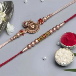 eCraftIndia Golden & Red Pearl Rakhis with Roli Chawal Pack - Set of 2-10