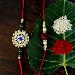Karatcart Gold-Plated Kundan Rakhi with Roli Chawal & Greeting Card for Brother - Set of 2-98