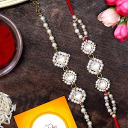 Karatcart Gold-Plated Pearl Beaded Kundan Rakhi, Roli & Chawal for Bhai & Bhabi - Set of 2-97