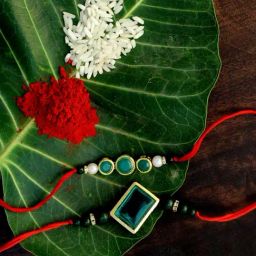 Karatcart Gold-Plated Kundan Rakhi with Roli Chawal & Greeting Card for Brother - Set of 2-43