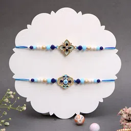 Myntra Elegant Homes Set Of 2 Evil Eye & Floral Rakhis With Greeting Card & Roli Chawal-image-43