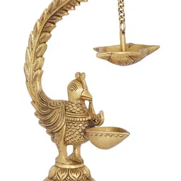 Exotic India Gold Toned Brass Lamp With Five Wicks Diya Hanging On Peacock's Tail-image-35