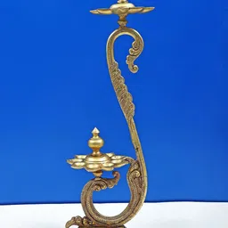 Exotic India Gold-Toned Double Layer Peacock Wicks Lamp Showpiece-image-22