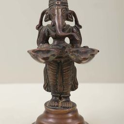 Exotic India Gold Toned Lord Ganesha Twin Lamps Showpiece-image-9