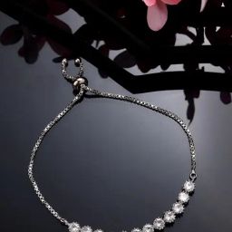 NVR Silver-Plated American Diamond Studded Rakhi with Roli Chawal-image-0