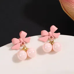 VAGHBHATT Gold-Plated Pearls Studded Bow Shaped Studs-55