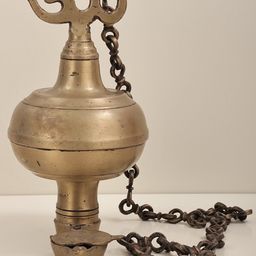 Exotic India Gold Toned Brass Om Hanging Diya-image-45