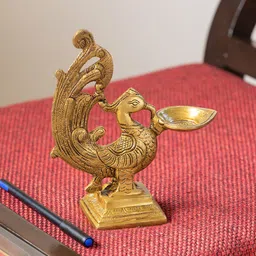 ExclusiveLane Gold Toned Marvellous Peacock Hand-Etched Carved Brass Diya-56