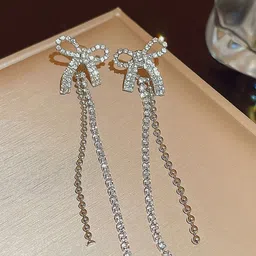 VAGHBHATT Silver-Plated Rhinestone Studded Bow Design Drop Earrings-1