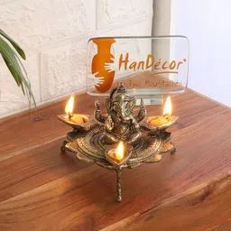Two Moustaches Gold Toned Textured Ganesha On Lotus With Three Leaf Design Diya image 4