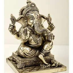Exotic India Gold-Toned & Black Lord Ganesha Seated On Pedestal & Eating Modak Showpiece-66