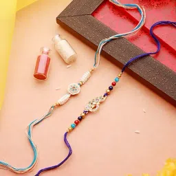 Aatmana Set of 2 White Pearl Beaded & Blue Peacock Shaped Designer Rakhi with Roli Chawal-picture-1