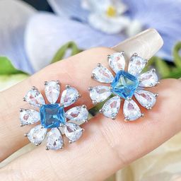 Jewels Galaxy Silver-Plated American Diamond Studded Floral Shaped Studs-55