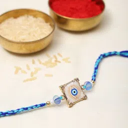 Exotic India Stone Studded & Beaded Square Shape Evil Eye Thread Rakhi-image-85