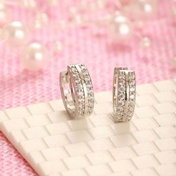 Jazz and Sizzle Rhodium Plated American Diamond Studded Circular Shaped Hoop Earrings-50