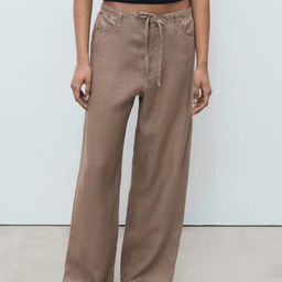 MANGO Women Mid-Rise Pure Line Flared Fit Wide Leg Trousers-image-18