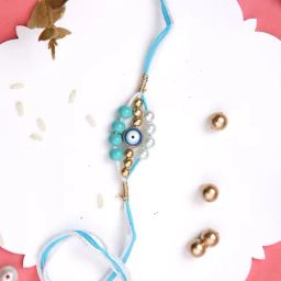 Aapno Rajasthan Blue Evil Eye Pearl Rakhi-image-74
