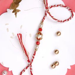 Aapno Rajasthan Red & White Twisted Rakhi with a Pearl-image-83