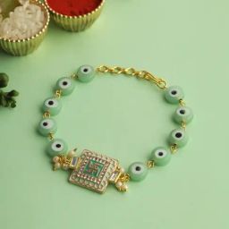 Aapno Rajasthan Gold Swastik Green Enameled Black Eye Bracelet Rakhi-43