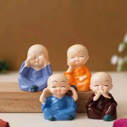 eCraftIndia Multicolor Polyresin Cute Little Monk Buddha Statues Showpieces - Set of 4-7