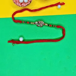 ORANGENYSHA Set Of 3 Beaded Cotton Thread Rakhis With Rholi Chawal-11