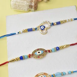 MEIRA JEWELLERY Set Of 3 Sacred Evil Eye Rakhis With Greeting Card & Roli Chawal-10