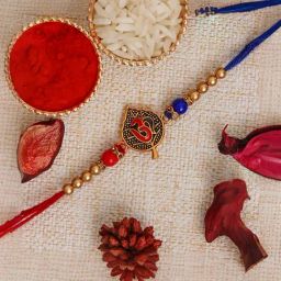 eCraftIndia Red & Blue Om Symbol On A Leaf Rakhi for Bhai with Sibling Agreement & Roli Chawal Pack-image-51