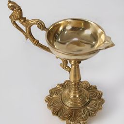 Exotic India Gold Toned Brass Handheld Diya-image-67