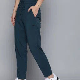 Puma Studio Women Teal Blue Solid Tapered Woven dryCELL Training Sustainable Track Pants-image-66