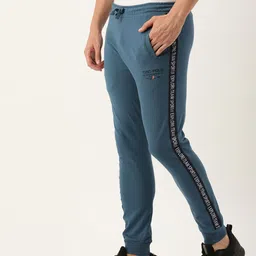 The Indian Garage Co Men Teal Blue Solid Joggers with Side Tape Printed Detail-picture-21