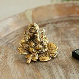 ExclusiveLane Golden Aluminium Ganesha On Flower Decorative Idol-picture-19