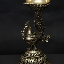Exotic India Gold-Toned Peacock Diya Brass Showpiece-image-22