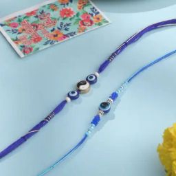 NVR Blue Evil Eye Artificial Beads Thread Rakhi with Roli Chawal Chandan & Mishri - Set of 2 image 2