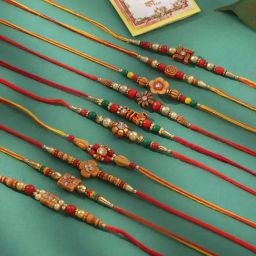 NVR Red Floral Design Red Stones & Beads Thread Rakhi with Roli Chawal Chandan & Mishri - Set of 10-17