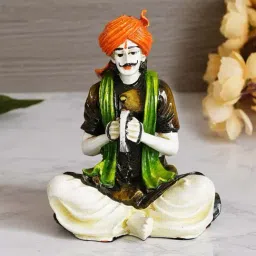eCraftIndia Colorful Rajasthani Man Playing Musical Instrument Handcrafted Decorative Polyresin Showpiece-37