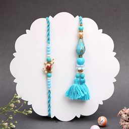 Myntra Elegant Homes Set Of 2 Teardrop Beaded Rakhis With Greeting Card & Roli Chawal-image-13