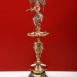 Exotic India Gold Toned Brass Krishna Lamp Showpiece-image-92
