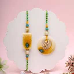 Myntra Elegant Homes Mayur Feather Bhaiya Bhabhi Rakhis With Greeting Card & Roli Chawal-image-74