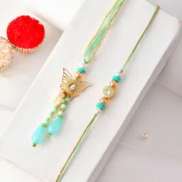 Myntra Elegant Homes Set Of 2 Meenakari Rakhis With Greeting Card & Roli Chawal-image-11