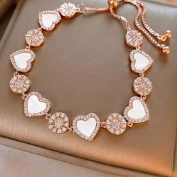 Peora Rose Gold-Plated Cubic Zirconia Studded Heart Shaped Wraparound AdjustableBracelet-16