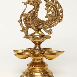 Exotic India Gold Toned Seven Wicks Peacock Brass Diya Lamp-image-97