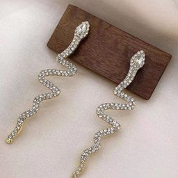 WHITE LIES Gold-Toned & White Rhinestone Studded Contemporary Snake Drop Earrings-image-36