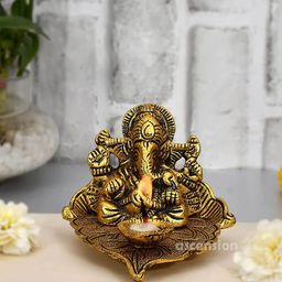 Ascension Gold Toned Lord Ganesha on Leaf with Diya Idol Showpiece-image-71