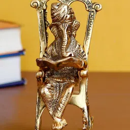 eCraftIndia Gold-Toned Lord Ganesha On Rocking Chair Showpiece-58
