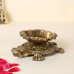 Two Moustaches Brown Swastika Engraved Brass Diya Over Tortoise-image-45
