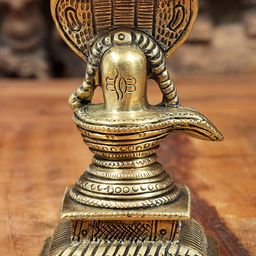 Exotic India Gold Toned Shiva Linga With Five Hooded Crowning Serpent Idol Showpiece-image-18