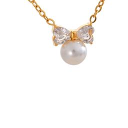 INTERSTELLAR Gold-Plated Bow With Pear & American Diamond Pendants-picture-4