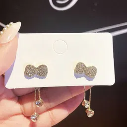 Celestria Korean Artificial Stones Studded Bow Shaped Drop Earrings-3