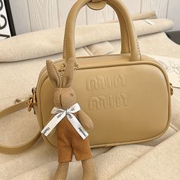 DressBerry Women Solid Tasselled Structured Handheld Bag-image-38
